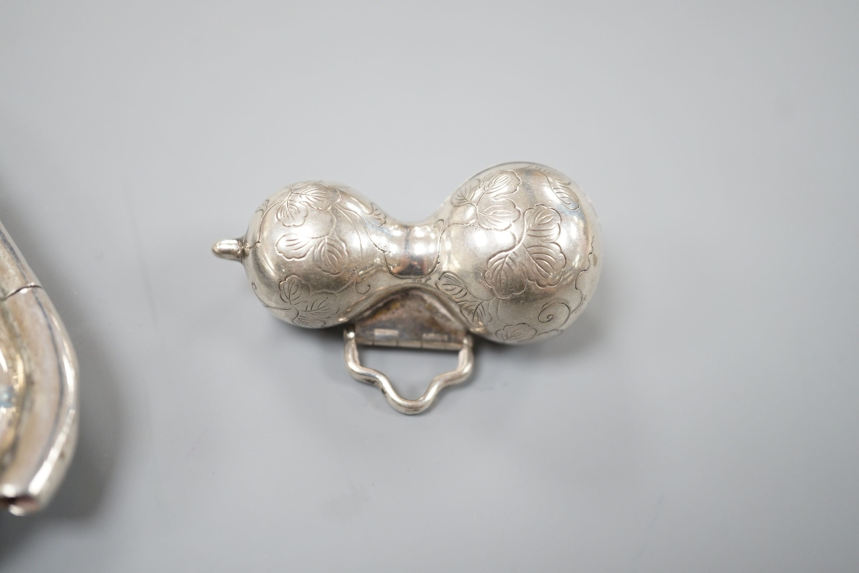 A late 19th century Japanese white metal two cased inro, 83mm and a similar single cased gourd shaped inro?